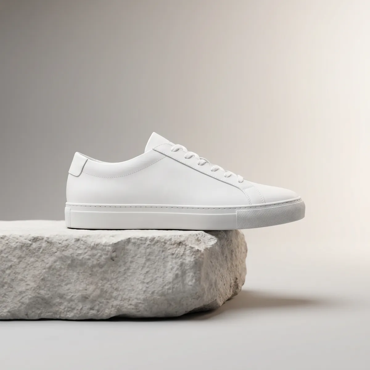 Minimalist sneaker on a stone pedestal — AI product photography